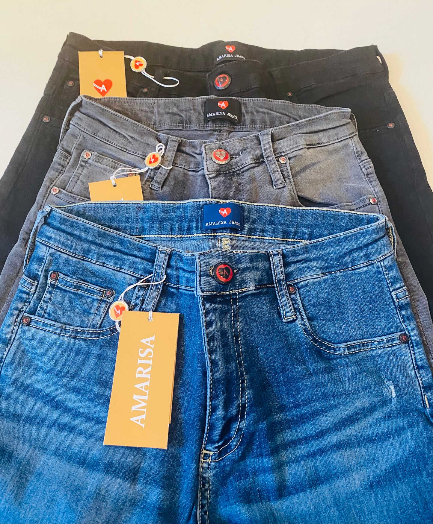 Blue distressed skinny jeans with ankle slits